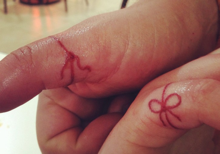 Red string tattoo on hand: Here’s what it means