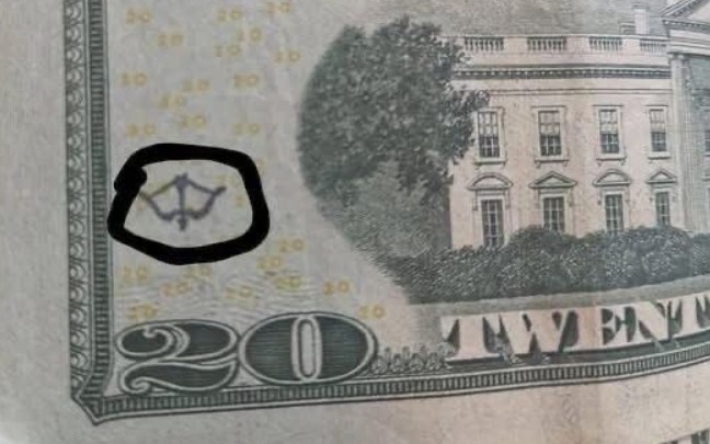 The Hidden Story Behind the Bow-and-Arrow Symbol on Your $20 Bill: How Secret Marks on U.S. Currency Reveal Centuries-Old Trade Practices, Covert Verification Networks, and Financial Traditions You Probably Didn’t Know About.