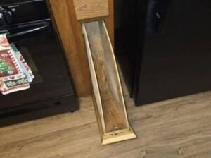 Found this cabinet door in our new house. What is this supposed to be used for?