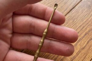 I found this tiny brass SPOON in my mother’s old drawer, but i have no idea what it is. does anyone know?
